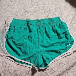 Green Athletic Shorts with White Trim and Elastic Waistband